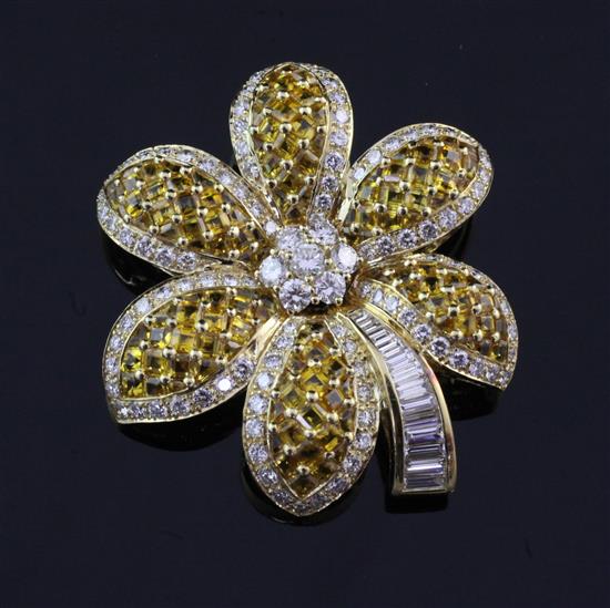 An unmarked yellow gold, diamond and yellow sapphire flower head brooch, 1.75in.